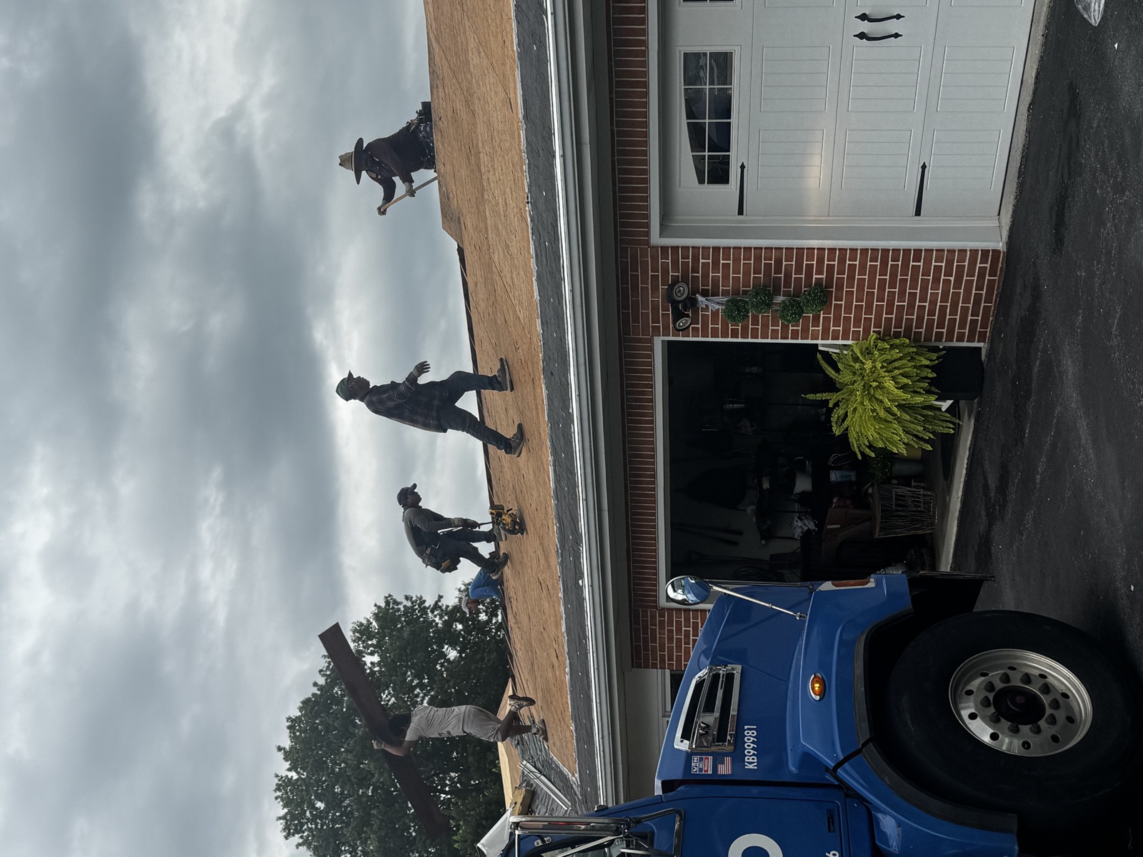 Ridgeway Roofing crew installing new decking on a Berks County roof